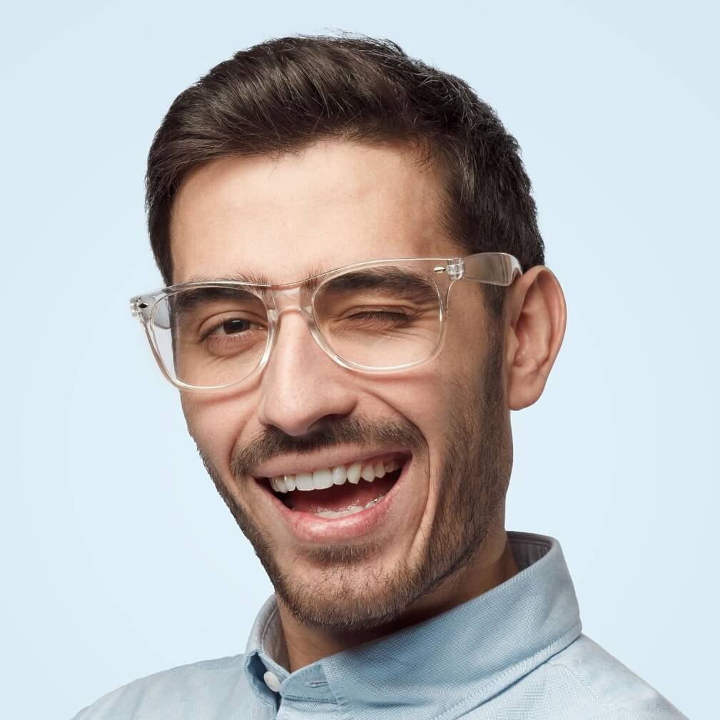 young trendy man winking with smile as if having f CU2TFSR